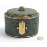 An Art Deco style tea caddy of oval form with shagreen covering.