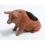 A Novelty cold painted bronze pin cushion formed as a seated pig.