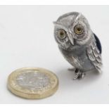 A novelty pin cushion formed as an owl.