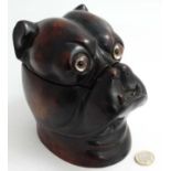 A carved wooden tobacco pot formed a a bulldog.