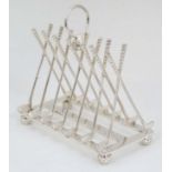 Golfing Interest : A novelty 6-slice silver plated toast rack,