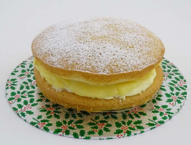 Victoria sponge with lemon and butter cream filling with a festive dusting of icing sugar Kindly