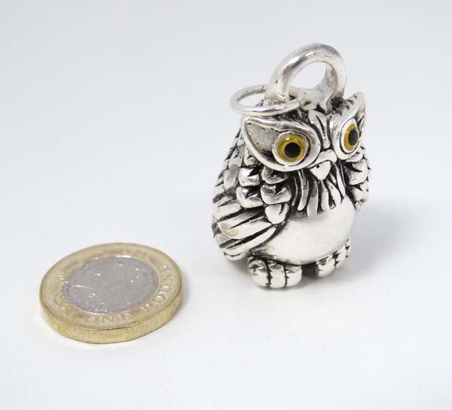 A silver pendant / large charm formed as an owl 1 3/4" high CONDITION: Please Note