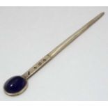 A silver letter opener / paper knife set with amethyst coloured cabochon.