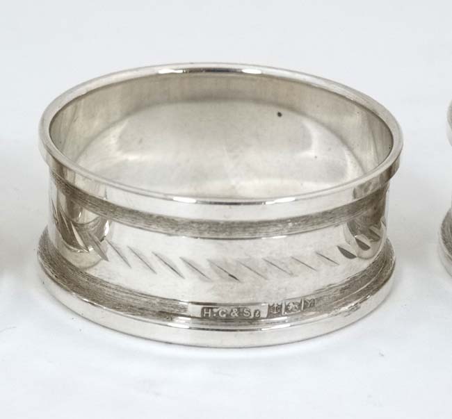 A cased set of 4 silver napkin rings hallmarked Birmingham 1973/74 maker Henry Griffith & Sons Ltd - Image 3 of 4