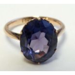 A 9ct gold ring set with facet cut semi precious purple / blue stone CONDITION: