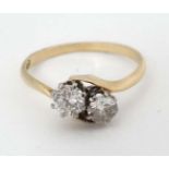 An 18ct gold ring set with two diamonds CONDITION: Please Note - we do not make