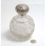 A cut glass scent / perfume bottle of spherical form with silver top hallmarked Birmingham 1900