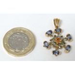 A 9ct gold pendant set with blue green and amber coloured stones 1" long CONDITION: