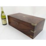 A 19th C Mahogany campaign writing box, with inkwells various trays and two hidden compartments,