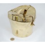 Hunting Interest : An novelty gilt plated box formed as a saddle formed hat box with hinged lid.