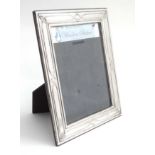 A silver photograph frame hallmarked Sheffield 2000 maker Carrs of Sheffield.