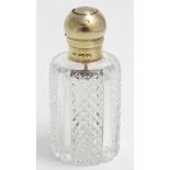 A Victorian cut glass scent / perfume bottle with silver gilt atomizer top hallmarked London 1885