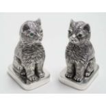 A novelty white metal (.800 silver) salt and pepper cruet formed as seated cats.