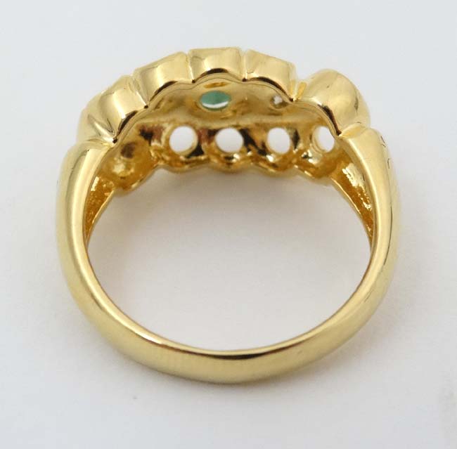 An 18ct gold ring set with central green stone flanked by two diamonds CONDITION: - Image 5 of 5