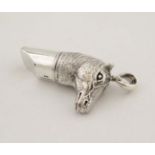 A silver whistle with horsehead decoration. marked '925 Sterling '. 21stC.