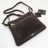 A new Osprey London 'Canterbury X-Body' Nappa leather cross body bag in chocolate colour,