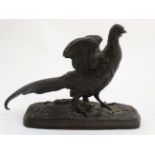 A late 19 thC Spelter figure of a pheasant on an oblong base.