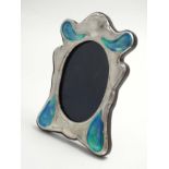 A silver photograph frame with Art Nouveau style enamel decoration. 21stC.