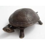 A 21st cast bronze novelty table top / counter / desk bell formed as a tortoise having hinged head