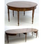 A Victorian mahogany 6-legged extending dining table with a beautifully figured frieze,
