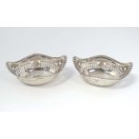 A pair of small silver dishes with pierced decoration hallmarked Birmingham 1912 maker Levi &