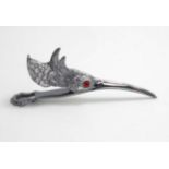 A novelty silver plate letter / paper clip formed as a birds head with glass eyes 5 1/4" long