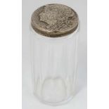 A glass dressing table jar with silver top having Art Nouveau female head decoration hallmarked