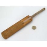 A novelty small cricket bat probably by Grey Nicholls? 11 1/2" long CONDITION:
