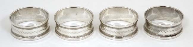 A cased set of 4 silver napkin rings hallmarked Birmingham 1973/74 maker Henry Griffith & Sons Ltd