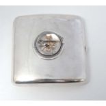 A silver cigarette case of shaped form Hallmarked Birmingham 1925 maker A&J Zimmerman Ltd.