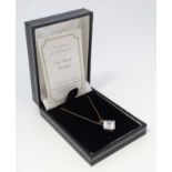 A 9ct gold necklace set with cubic Zirconia pendant.