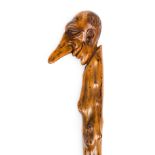 *Folk Art. A carved folk art stick, the grip carved as Ally Sloper with typical elongated nose,