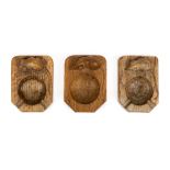 *Ashtrays. Robert "Mouseman" Thompson, three oak ashtrays each carved with a mouse, 10.5 cm long (