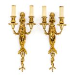 *Wall Light. A pair of French gilt metal twin branch wall lights, circa 1900, modelled as child