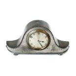 *Clock. A Tudric pewter mantel clock no. 01569, the hammered Napoleon hat case with silvered