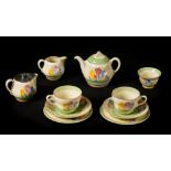 *Clarice Cliff. A 1930s Crocus pattern tete-a-tete tea set, comprising teapot, milk and cream jug,