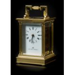 *Carriage Clock. A modern brass carriage timepiece by Matthew Norman, with white enamel dial black