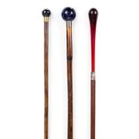 *Walking Canes. A Victorian ladies walking cane, with spherical porcelain knop in blue with gilt and