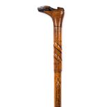 *Walking Stick. An Edwardian walking stick, carved with a boot in two tone colours, the shaft carved