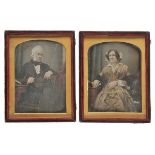 *Daguerreotypes. A pair of hand-coloured half-plate daguerreotypes of a middle-aged couple, circa