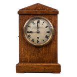 *RAF Clock. A WWII period RAF station mantel clock, the silvered circular dial with black roman