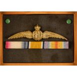 *Royal Flying Corps. RFC wings gilt metal bar brooch, 9.5cm long, presented in a frame with