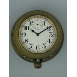 *Mechanical clock as fitted to veteran cars, a watch held in a brass case with a retaining ring. The