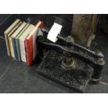 *Bookpress. A cast iron bookpress, early-mid 19th century, finished in black, with some rust crazing