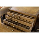 *Type. A modern seven drawer type cabinet containing a selection of brass type, together with