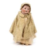 *Doll. A bisque head doll, Continental, circa 1910, composition character doll with articulated