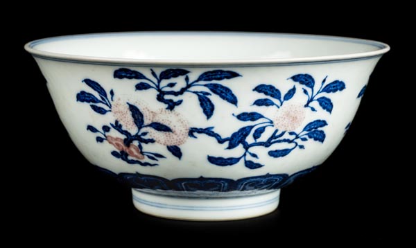 *Bowl. A Chinese porcelain bowl, the exterior decorated with peaches and fruit in blue and red,