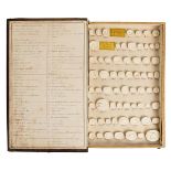 *Grand Tour. A 19th century book form box, containing 138 classical plaster seals, Impronte Gemmarie