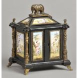 Table Cabinet. A late 19th century Austrian enamel and ebonised table cabinet, the top surmounted by